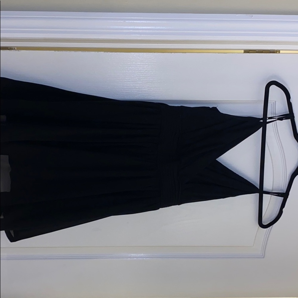 Medium black dress. Knee high with bow on back